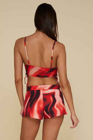 Back pose #1 of Trade Winds in Bahama Board Shorts paired with matching Auger Bralette Bikini Top