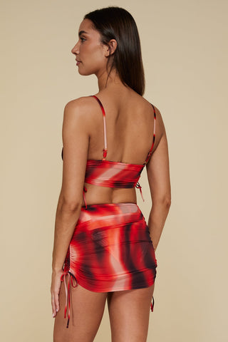 Oblique pose #1 of Trade Winds in Auger Bralette Top paired with matching Hadal High Waist Bottom