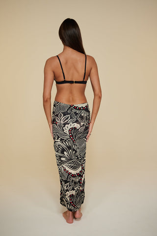 Back pose #1 of Miyajima in Caspian Cover-up as a skirt paired with Black Depth Meridian Underwire Bikini Top